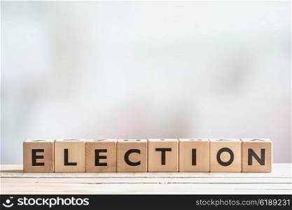 Election sign made of wooden blocks on a table