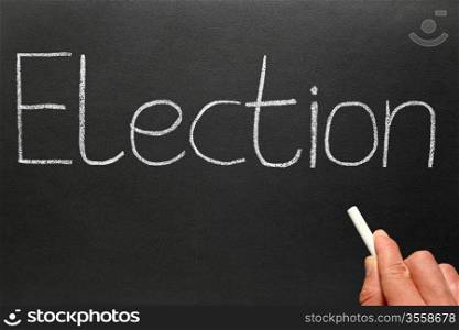 Election, written with white chalk on a blackboard.