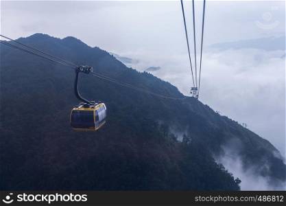 Electric cable car go to Fansipan mountain peak the highest mountain in Indochina, At 3,143 metres in Sapa, Vietnam.
