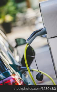 Electric car recharging with charge cable and plug leading to charge point