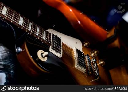 Electric guitar resting on the stage during a show