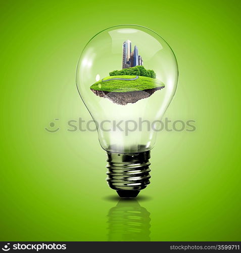 Electric light bulb and a plant inside it as symbol of green energy