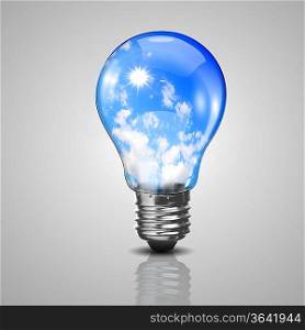 Electric light bulb and blue sky with clouds inside it