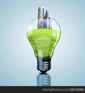 Electric light bulb and our planet inside it as symbol of green energy