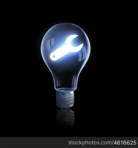Electric light bulb. Light bulb glowing icon on dark background