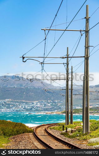 Electric Passenger Railway line on the shoreline of False Bay, Cape Town South Africa