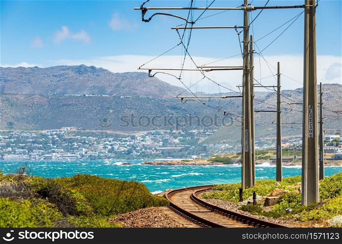 Electric Passenger Railway line on the shoreline of False Bay, Cape Town South Africa