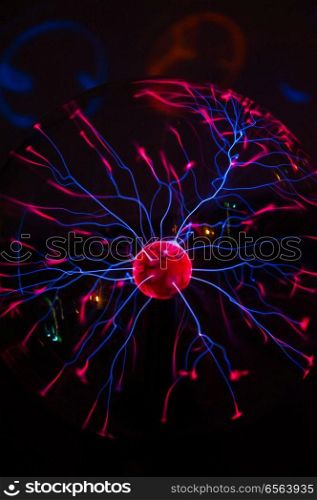 Electric plasma in glass sphere, concept for science, power, electricity, or physics. Electric plasma in glass sphere. Electric plasma in glass sphere