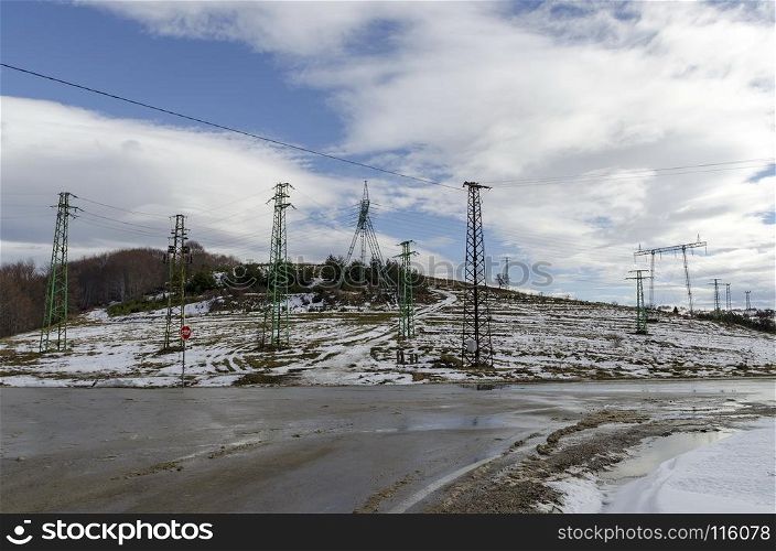 Electric power transmission line in winter, Plana mountain, Bulgaria