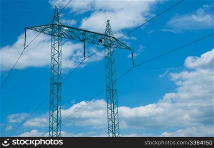 Electric Supply: Pillar With Wires Against Blue Cloudy Sky