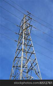 Electric tower view from below blue sky. Electric tower view from below under blue sky