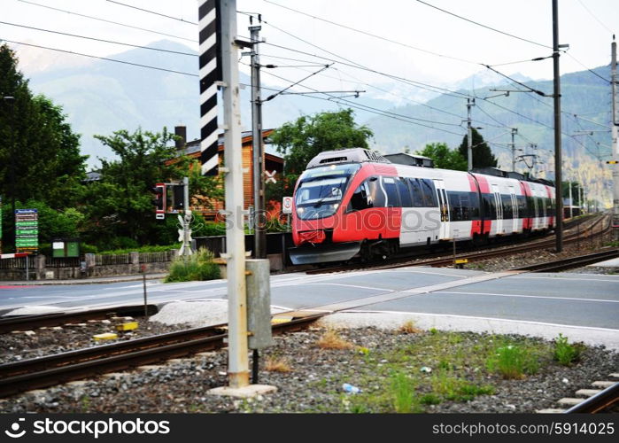 electric train rides on railroad