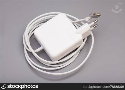 Electrical adapter to USB port on a gray background