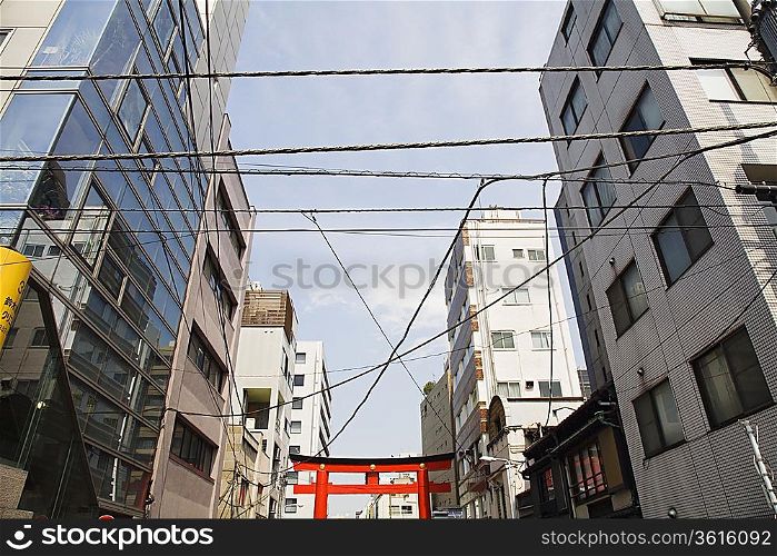Electrical Lines and Torii Gate Between Multistory Buildings