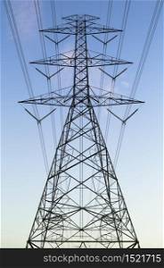 Electrical transmission tower with blue sky background.