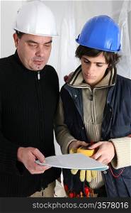 Electrician and apprentice