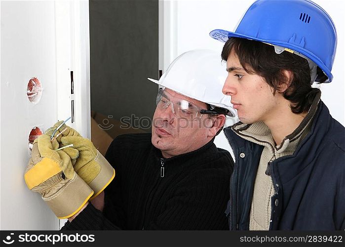 Electrician and his apprentice