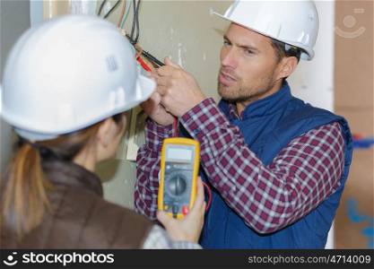 electrician and his assistant