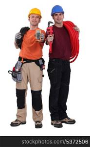 Electrician and plumber displaying equipment
