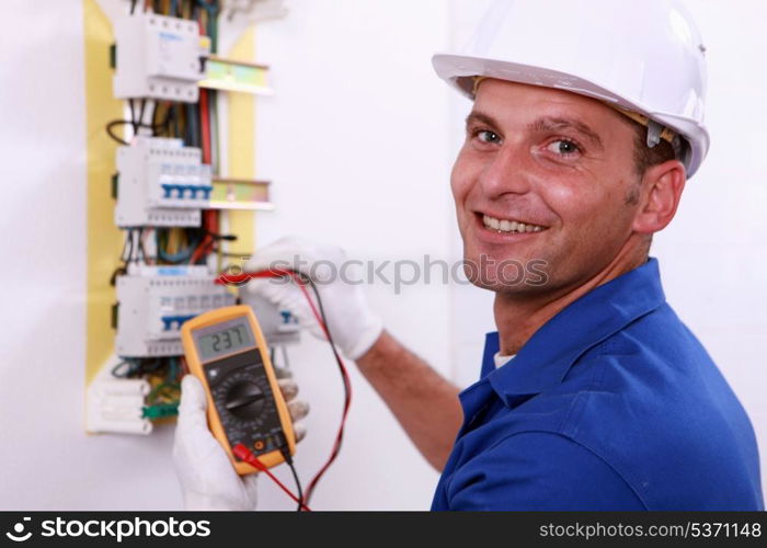 Electrician checking a fuse box