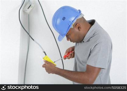 electrician fixing a wire
