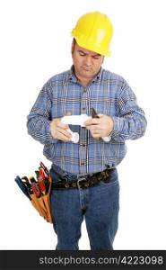 Electrician having trouble assembling plumbing pipe. Isolated on white.