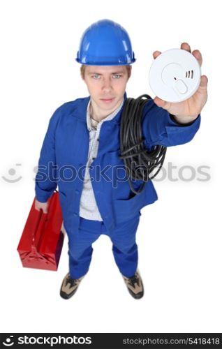Electrician holding alarm