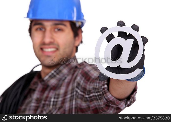 Electrician holding an @ sign