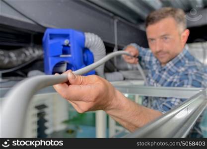 Electrician holding cable