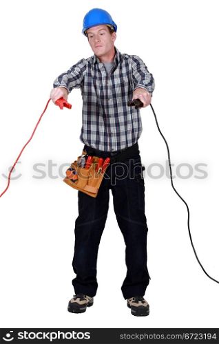 Electrician holding jumper cables