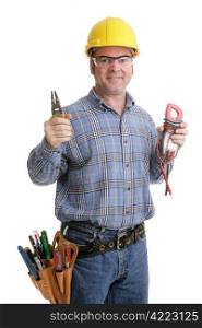 Electrician in safety goggles & hardhat holding up his wirestrippers and voltage meter. Authentic and accurate content depiction - model is actual master electrician.