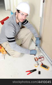 Electrician installing wiring