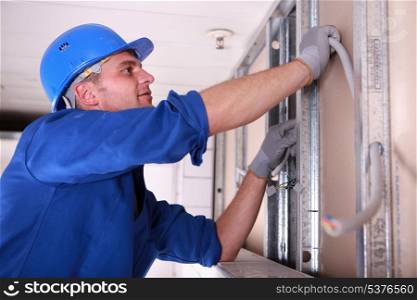 Electrician installing wiring