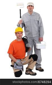 Electrician kneeling by painter