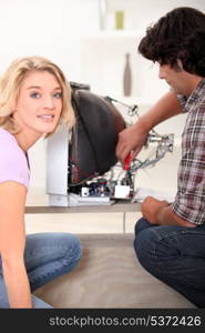 Electrician repairing broken television