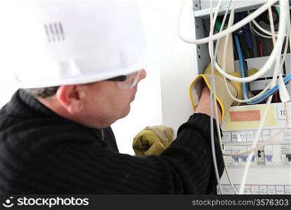 Electrician repairing electric meter