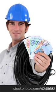 Electrician showing wad of bills