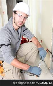 Electrician stripping a wire