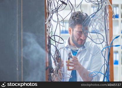 Electrician trying to untangle wires in repair concept