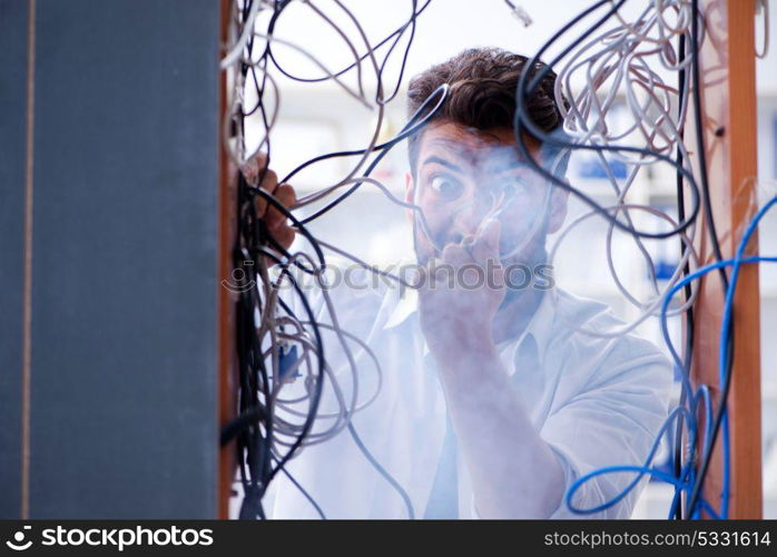 Electrician trying to untangle wires in repair concept