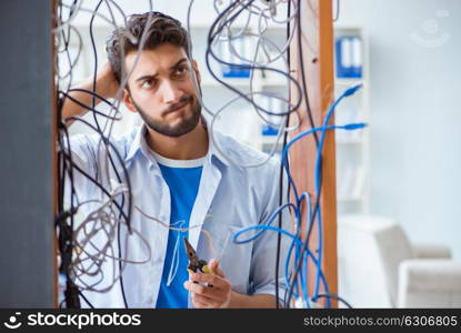 Electrician trying to untangle wires in repair concept