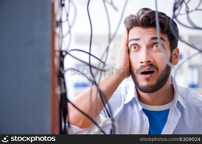 Electrician trying to untangle wires in repair concept