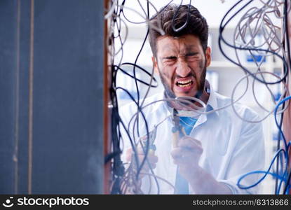 Electrician trying to untangle wires in repair concept