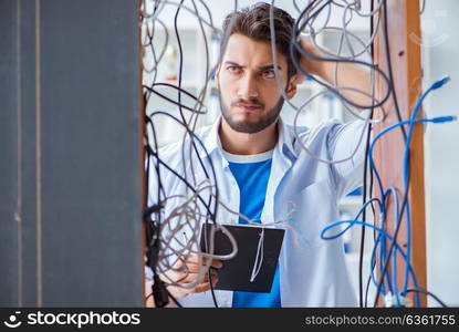 Electrician trying to untangle wires in repair concept