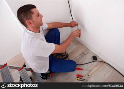 Electrician wiring a home