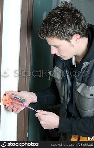 electrician wiring a house