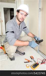 Electrician wiring up a home