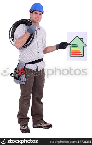 Electrician with a house energy rating sign