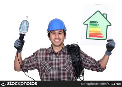 Electrician with a house energy rating sign