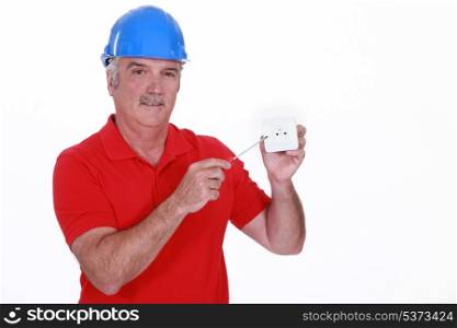 Electrician with wall socket